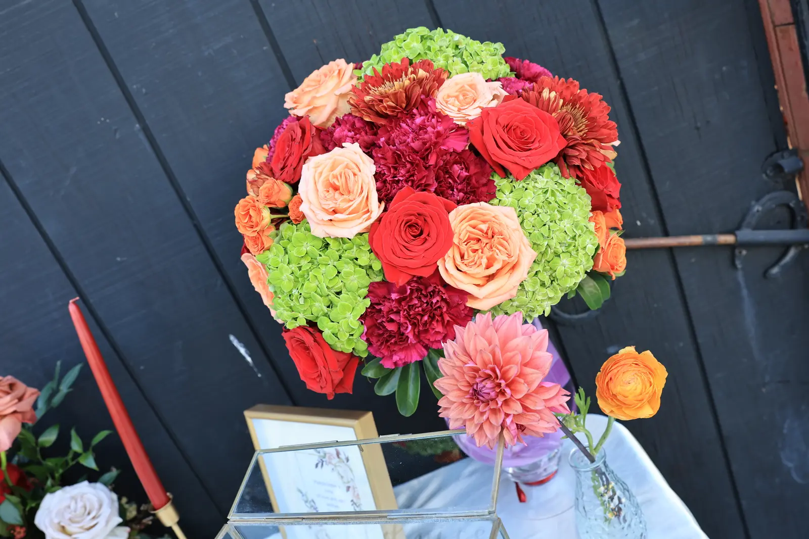 Rose and hydrangea sphere arrangement on the wedding welcome table
